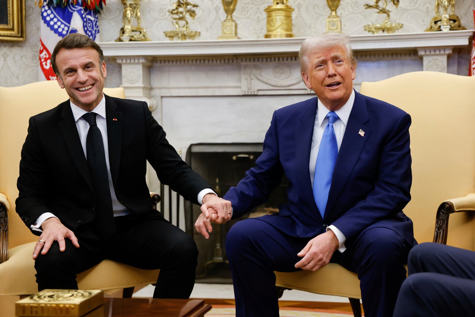 President Donald Trump, right, meets with France's President Emmanuel Macron in the Oval Office of the White House in Washington, Monday, Feb. 24, 2025. (Ludovic Marin/Pool via AP)