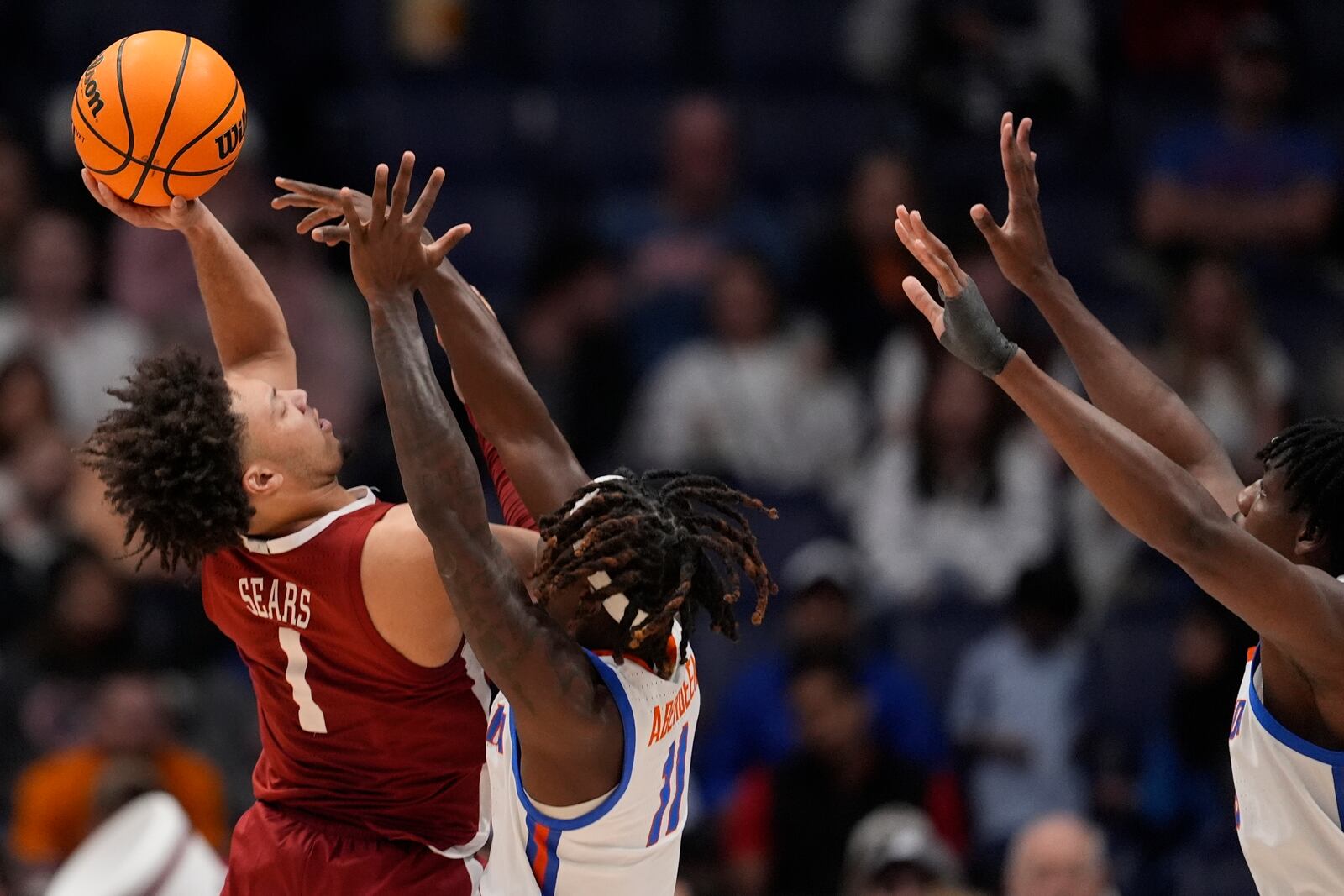 Alabama guard Mark Sears (1) shoots against Florida guard Denzel Aberdeen (11) during the second half of an NCAA college basketball game in the semifinal round of the Southeastern Conference tournament, Saturday, March 15, 2025, in Nashville, Tenn. (AP Photo/George Walker IV)