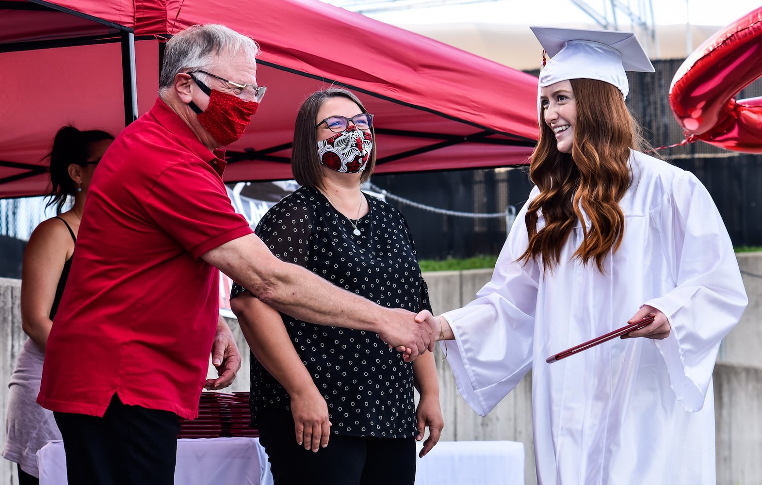 Madison High School drive-thru graduation ceremony at Land of Illusion