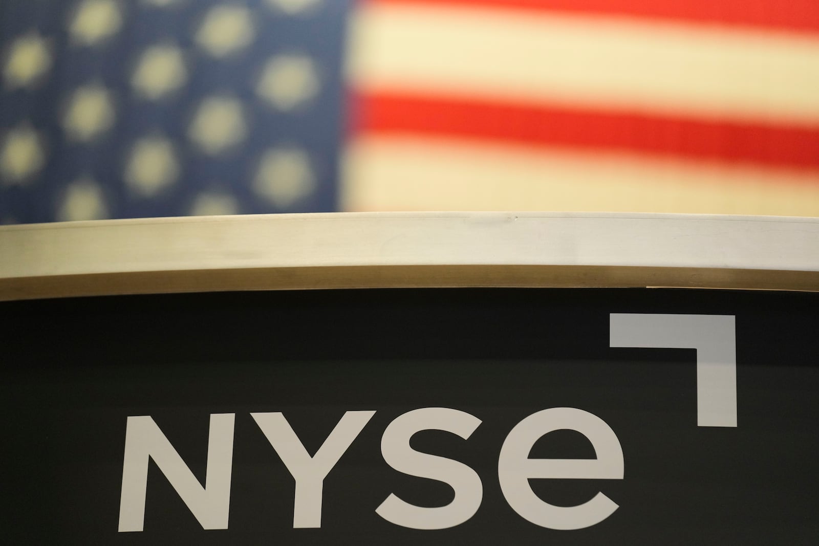 FILE - An NYSE sign is displayed on the floor at the New York Stock Exchange in New York, Thursday, Jan. 2, 2025. (AP Photo/Seth Wenig, File)