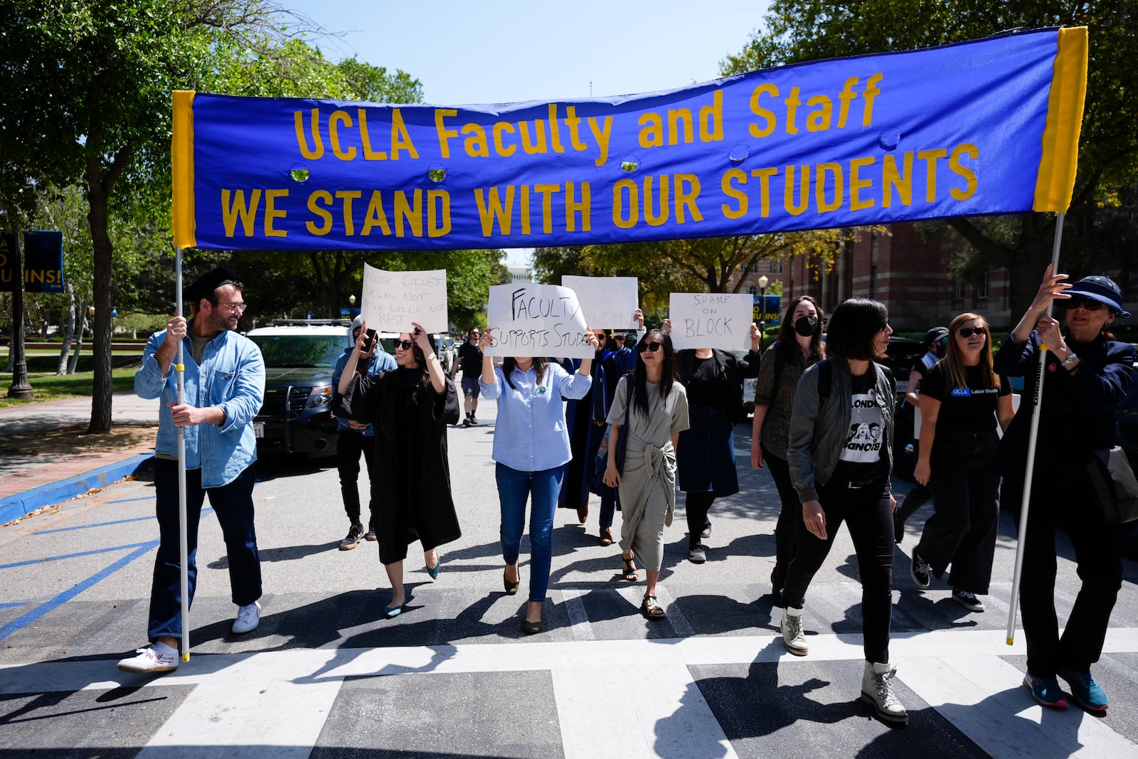 FILE - Faculty and staff march on the UCLA campus, after nighttime clashes between Pro-Israel and Pro-Palestinian groups, Wednesday, May 1, 2024, in Los Angeles. (AP Photo/Jae C. Hong, File)