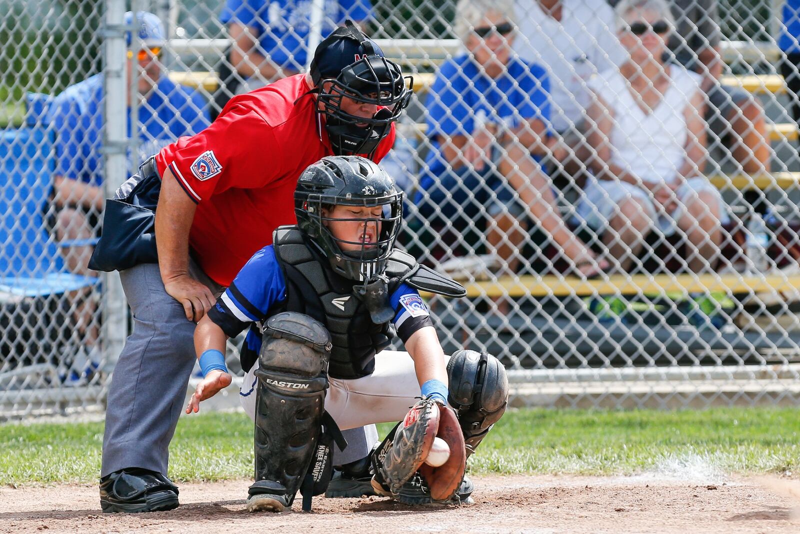 Hamilton West Side catcher Blake Detherage hauls in a pitch during Thursday’s winners’ bracket final against Canfield in the Ohio Little League 12-year-old baseball tournament at Ford Park in Maumee. CONTRIBUTED PHOTO BY SCOTT GRAU