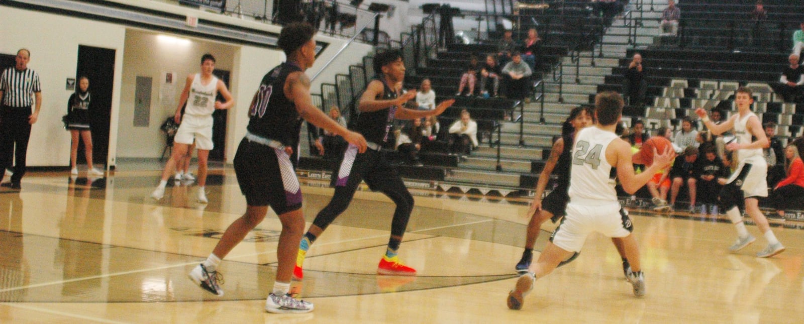 Lakota East’s Will Johnston (24) finds himself surrounded by Middletown defenders during Tuesday night’s game in Liberty Township. Host East won 64-54. RICK CASSANO/STAFF