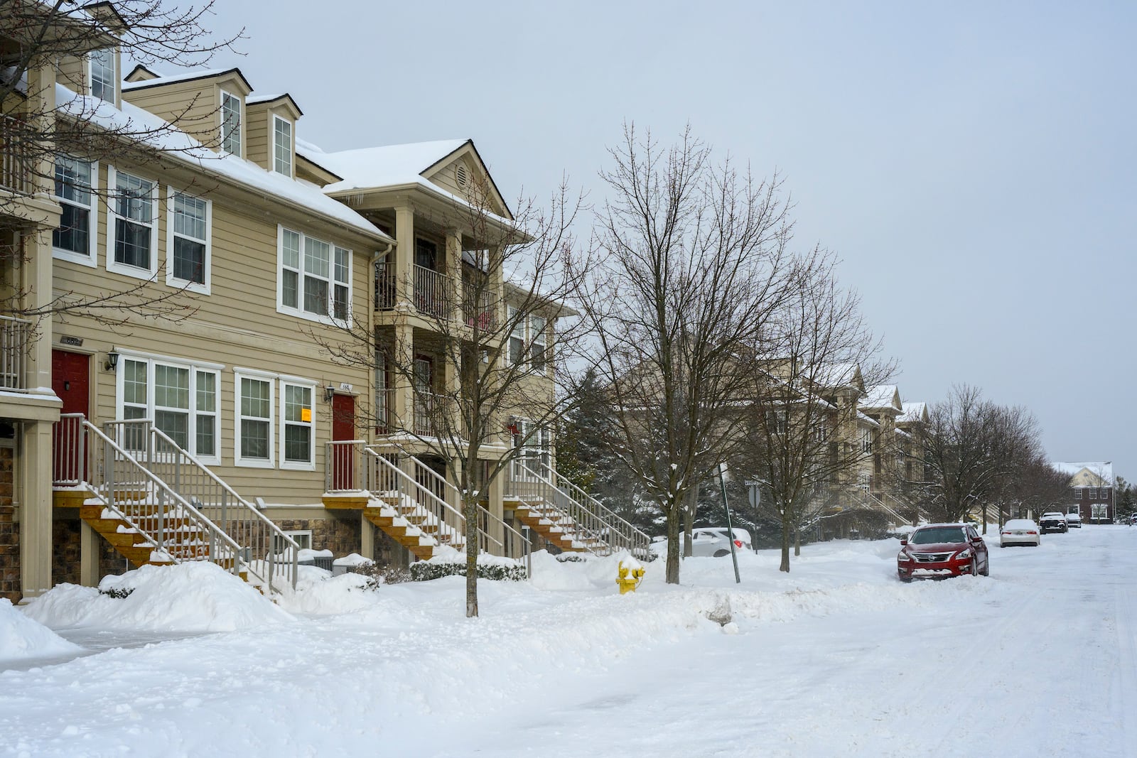 A sign from the City of Pontiac, Mich., is stuck to a window at 660 Lydia, along a row of homes in the 600 block of Lydia, Sunday, Feb. 16, 2025, in Pontiac, Mich., where a mother who allegedly left three of her children alone living in squalor in the home has been charged with three counts of first-degree child abuse. (Andy Morrison/Detroit News via AP)