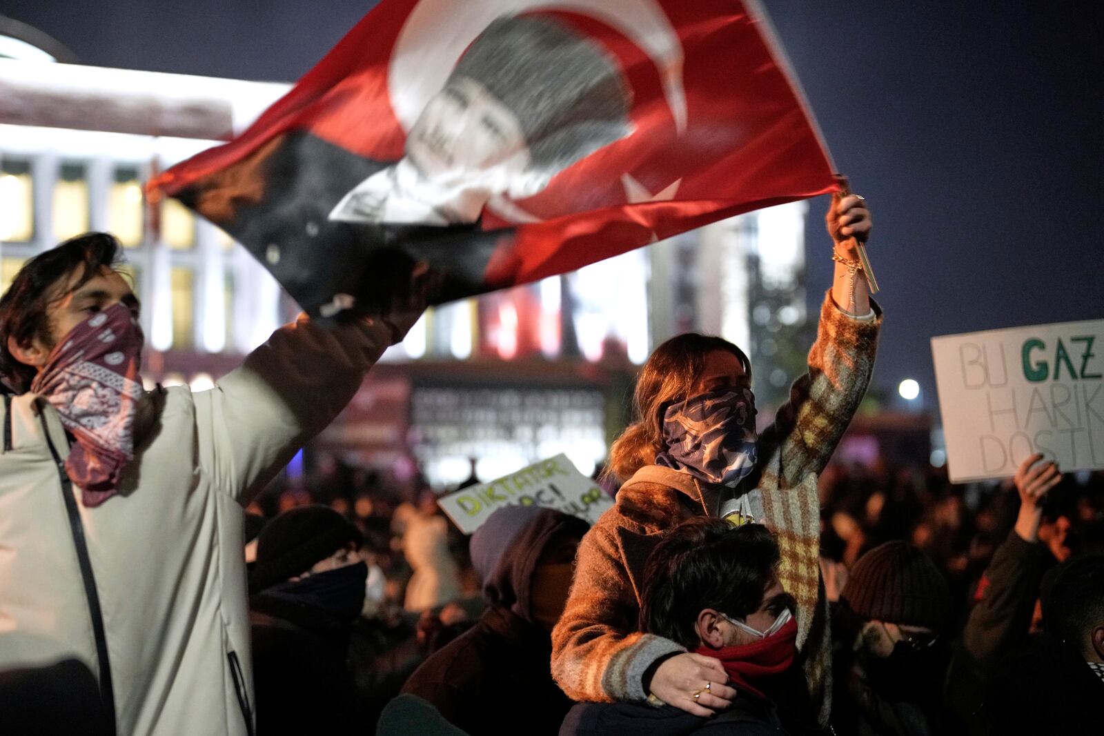 Protesters shout slogans during clashes with anti riot police during a protest against the arrest of Istanbul's Mayor Ekrem Imamoglu in Istanbul, Turkey, Friday, March 21, 2025. (AP Photo/Emrah Gurel)