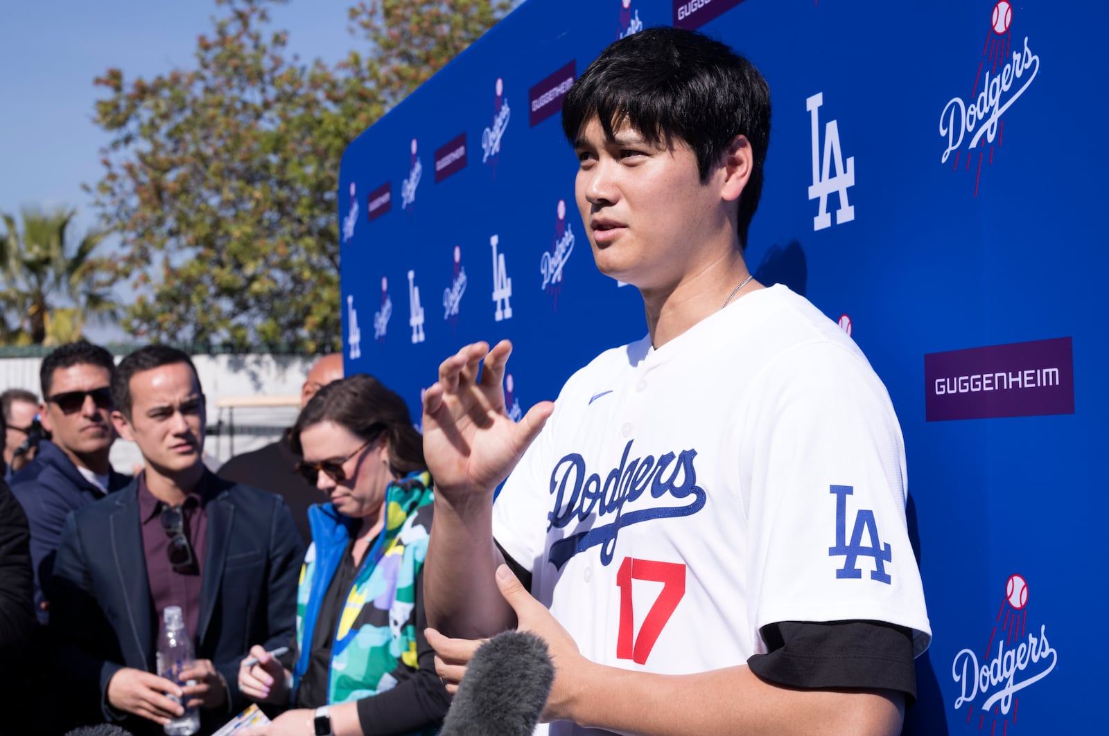 Los Angeles Dodgers' Shohei Ohtani talks to the media during a baseball interview during DodgerFest at Dodger Stadium, Saturday, Feb. 1, 2025, in Los Angeles. (AP Photo/Richard Vogel)