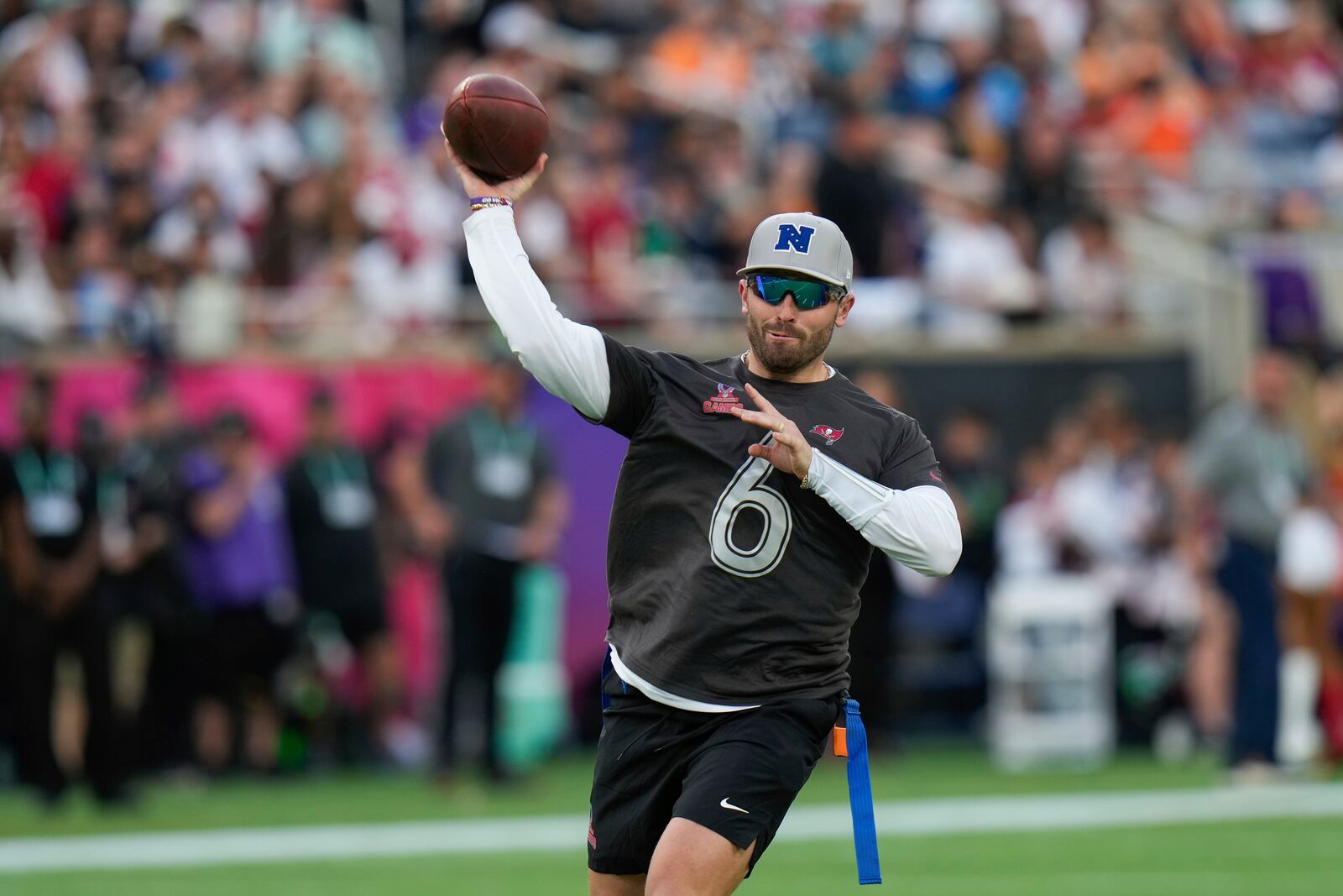 NFC quarterback Baker Mayfield, of the Tampa Bay Buccaneers, passes during the flag football event at the NFL Pro Bowl, Sunday, Feb. 2, 2025, in Orlando. (AP Photo/Chris O'Meara)