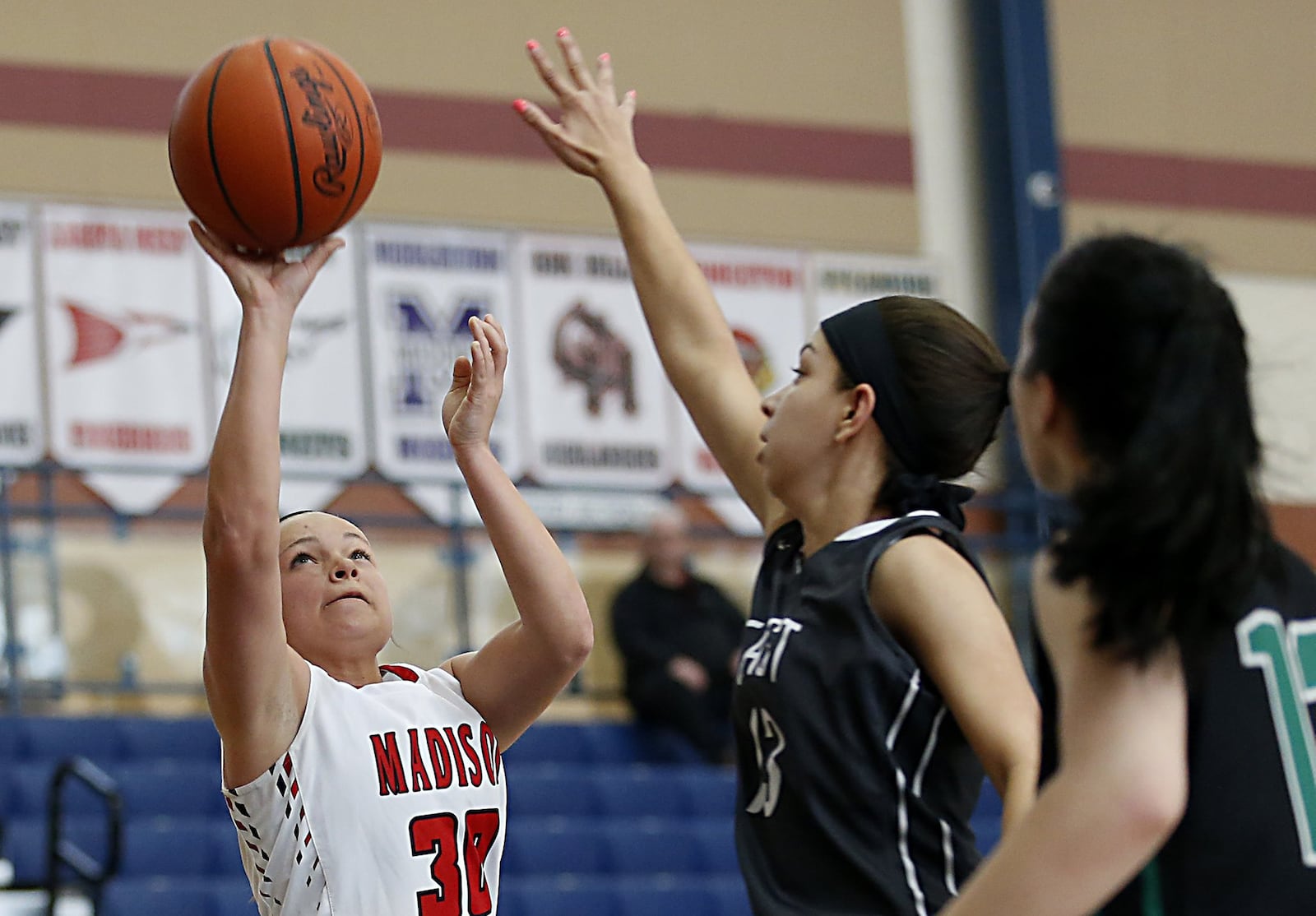 Madison guard Kenzi Saunders shoots while covered by Lakota East guard Jordan Stanley and New Miami guard Arielle Scalf during the All-Butler County All-Star girls basketball game at the Hamilton Athletic Center on April 7, 2018. CONTRIBUTED PHOTO BY E.L. HUBBARD