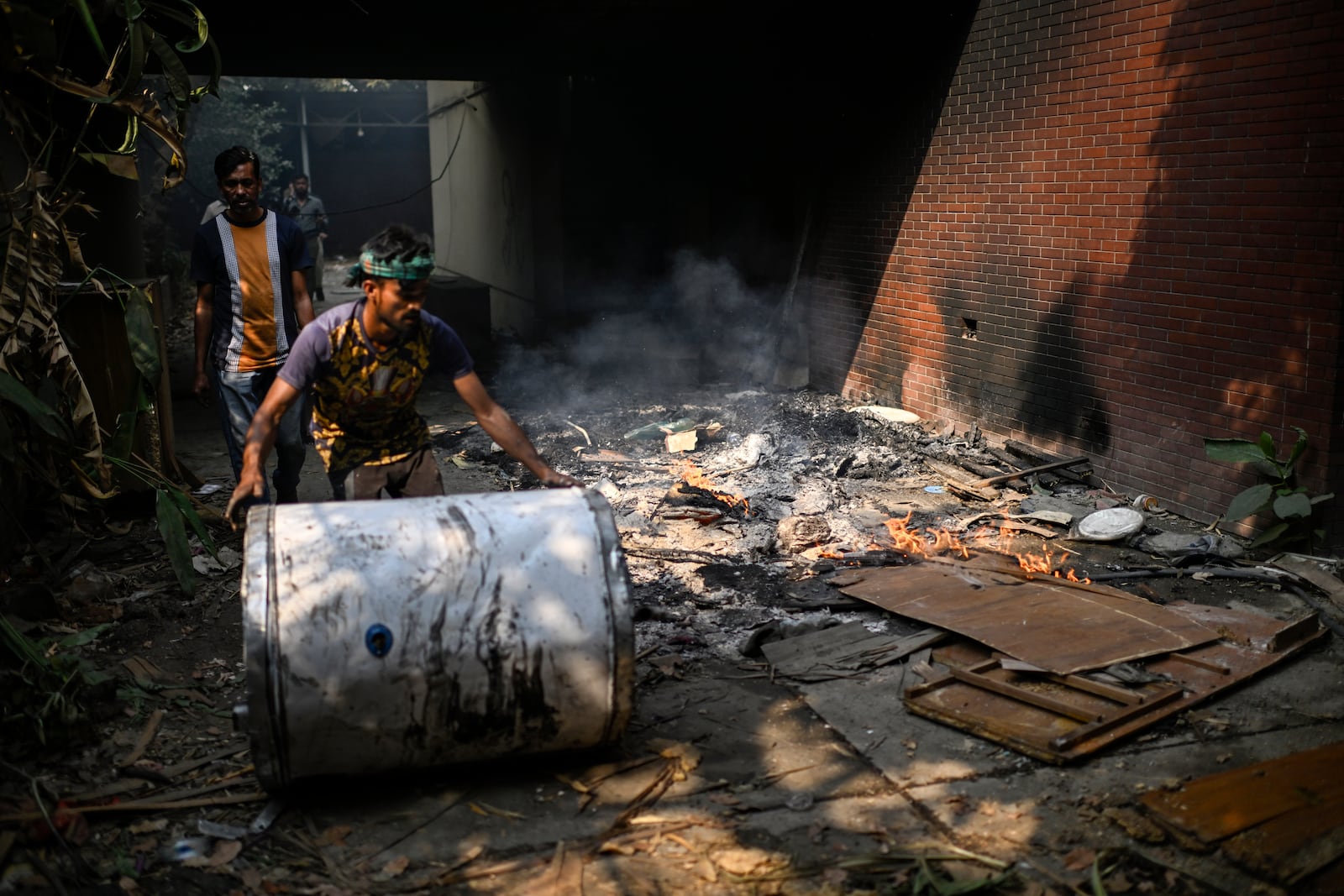 People walk around the vandalized residence of Bangladesh's ousted Prime Minister Sheikh Hasina, in Dhaka, Bangladesh, Thursday, Feb. 6, 2025. (AP Photo/Mahmud Hossain Opu)