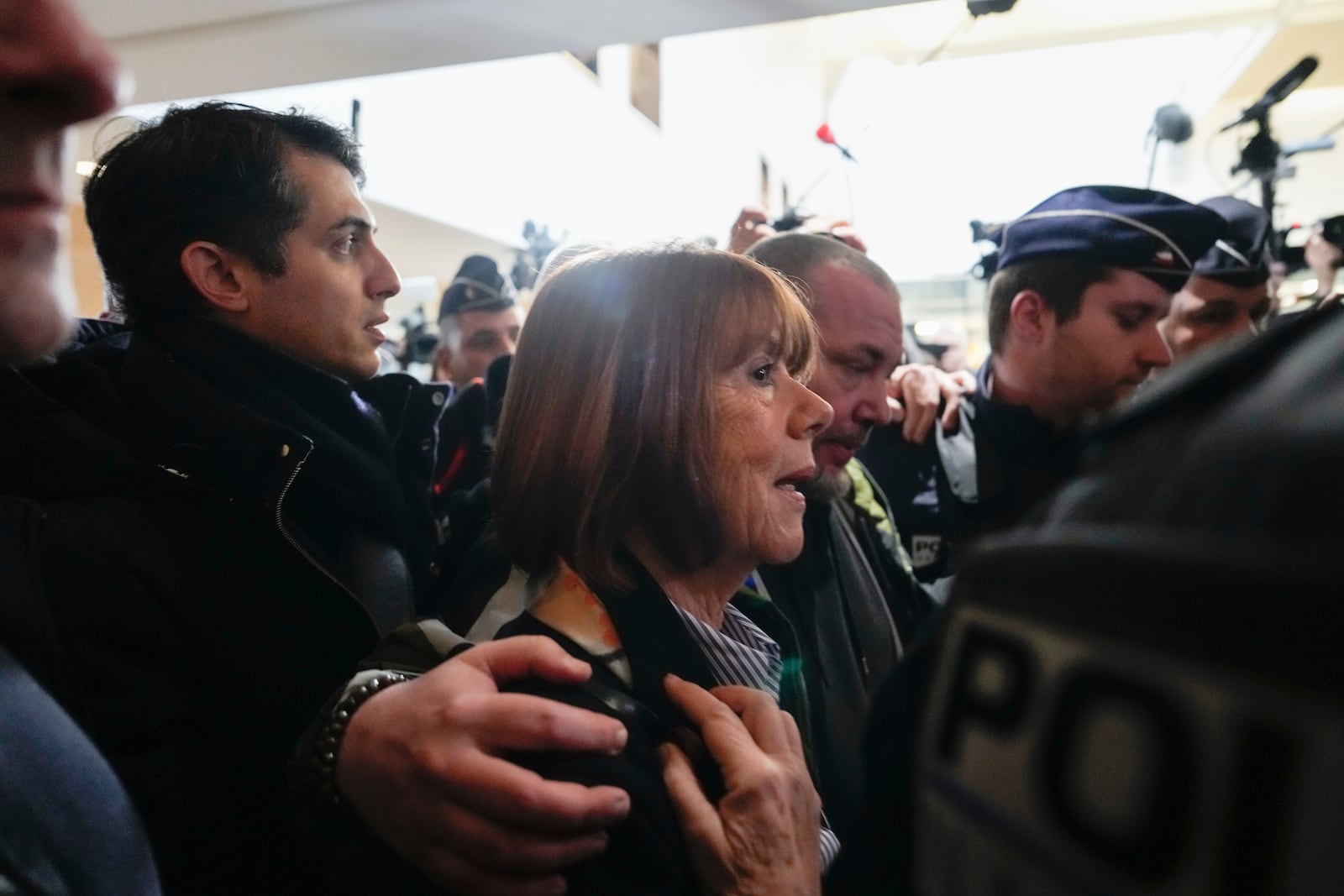 Gisele Pelicot, who was allegedly drugged by her now former husband so that he and others could assault her, arrives at the court house in Avignon, southern France, Thursday, Dec. 19, 2024. (AP Photo/Lewis Joly)