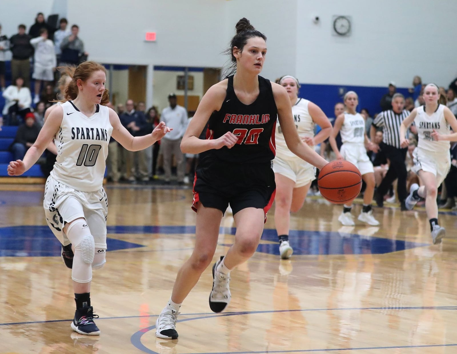 Franklin’s Layne Ferrell (30) follows a steal with a layup during Tuesday night’s Division II regional basketball semifinal against Valley View at Springfield. Franklin won 47-39 in overtime. BILL LACKEY/STAFF