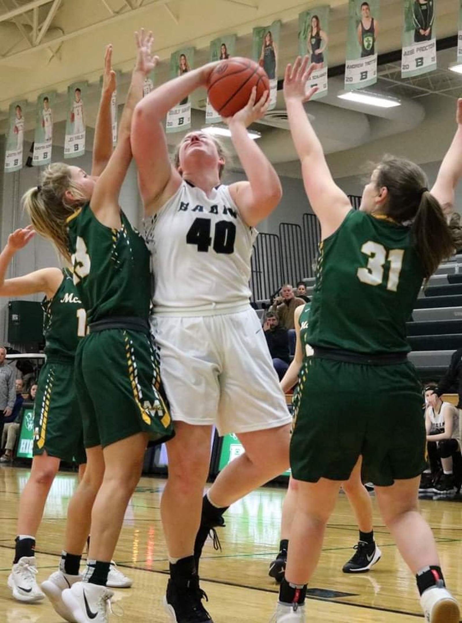 Badin’s Emma Broermann (40) goes up for a shot during the Rams’ 53-51 loss to McNicholas last Wednesday at Mulcahey Gym in Hamilton. Broermann became Badin’s all-time leading scorer Saturday with a 27-point performance at Purcell Marian. She has 1,230 career points, passing Kim Richter (1,228) on the girls side and John Richter (1,229) on the boys side. CONTRIBUTED PHOTO BY TERRI ADAMS