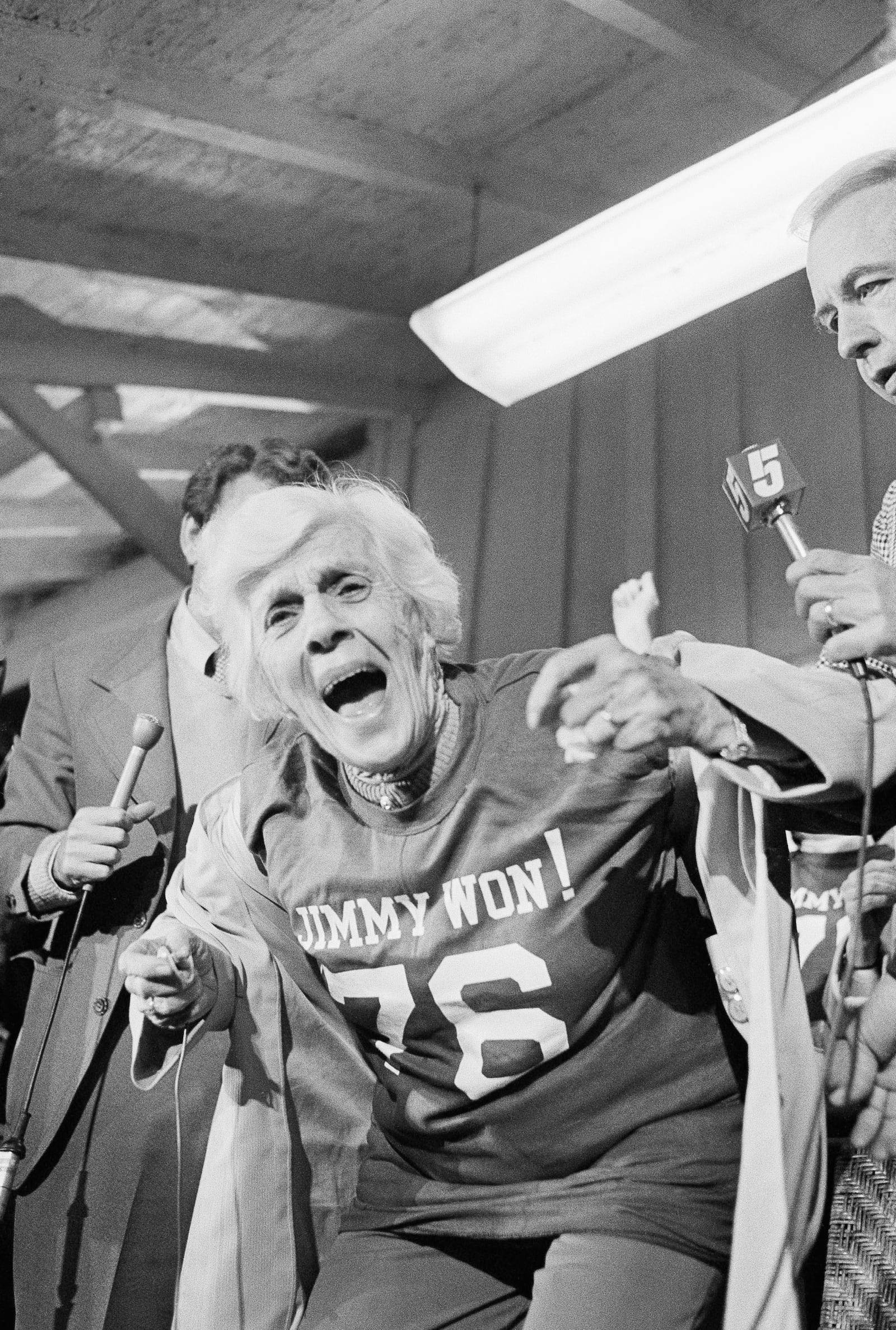 FILE - Lillian Carter, mother of Jimmy Carter, displays her "Jimmy Won!" T-shirt at a train station after Carter was declared the winner in the presidential election, Nov. 3, 1976, in Plains, Ga. (AP Photo, File)