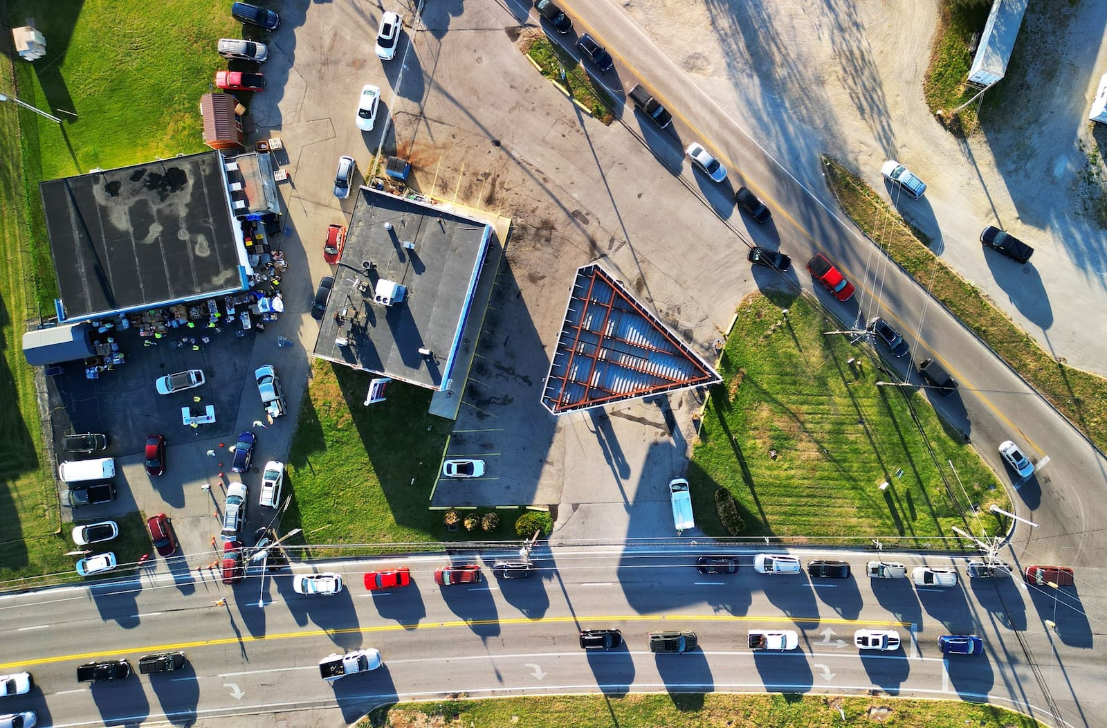 Cars line up for food distribution Wednesday, Nov. 8 at the Village Food Pantry in New Miami. NICK GRAHAM/STAFF