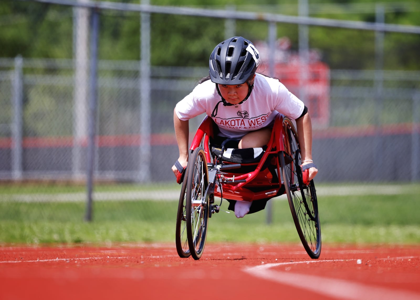 Jun McKnight 15, a sophomore at Lakota West, will compete as a seated athlete in the 100m, 400m and 800m races at the OHSAA state track meet. NICK GRAHAM/STAFF