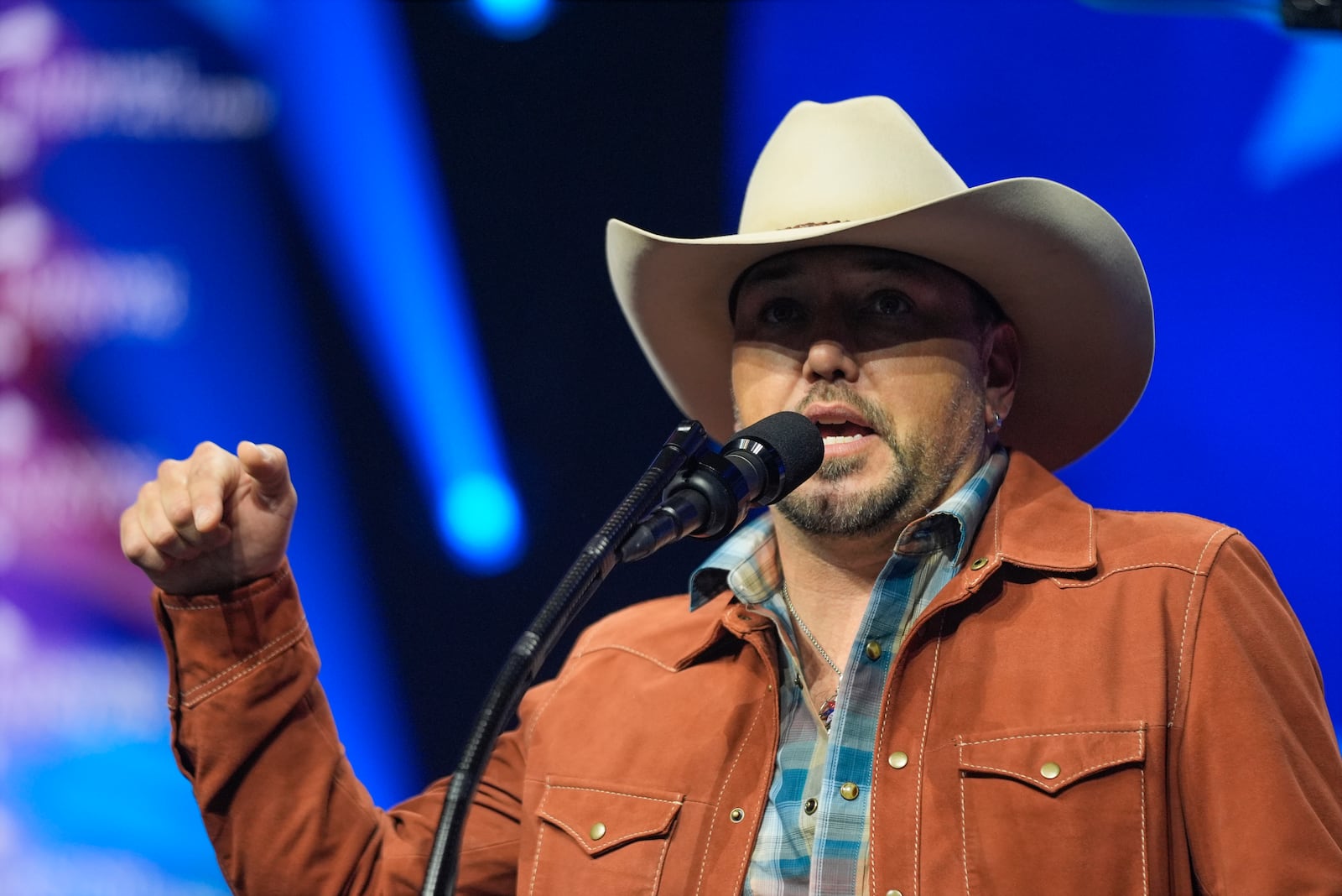 Jason Aldean speaks before Republican presidential nominee former President Donald Trump at a Turning Point Action campaign rally, Wednesday, Oct. 23, 2024, in Duluth, Ga. (AP Photo/Alex Brandon)