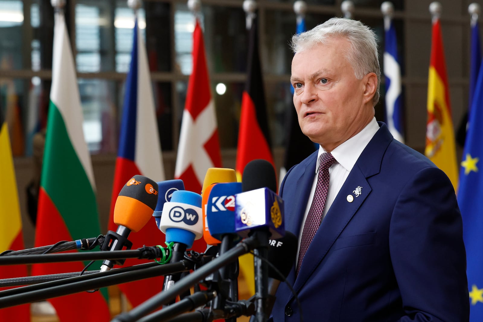 Lithuania's President Gitanas Nauseda talks to journalists as he arrives to an EU summit in Brussels, Thursday, Oct. 17, 2024. (AP Photo/Geert Vanden Wijngaert)