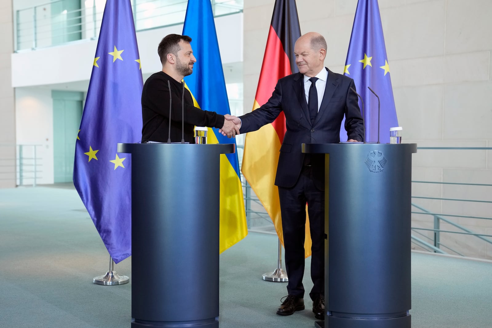 Ukraine's president Volodymyr Zelenskyy and German chancellor Olaf Scholz shake hands at the chancellery in Berlin, Germany, Friday, Oct. 11, 2024. (AP Photo/Ebrahim Noroozi)