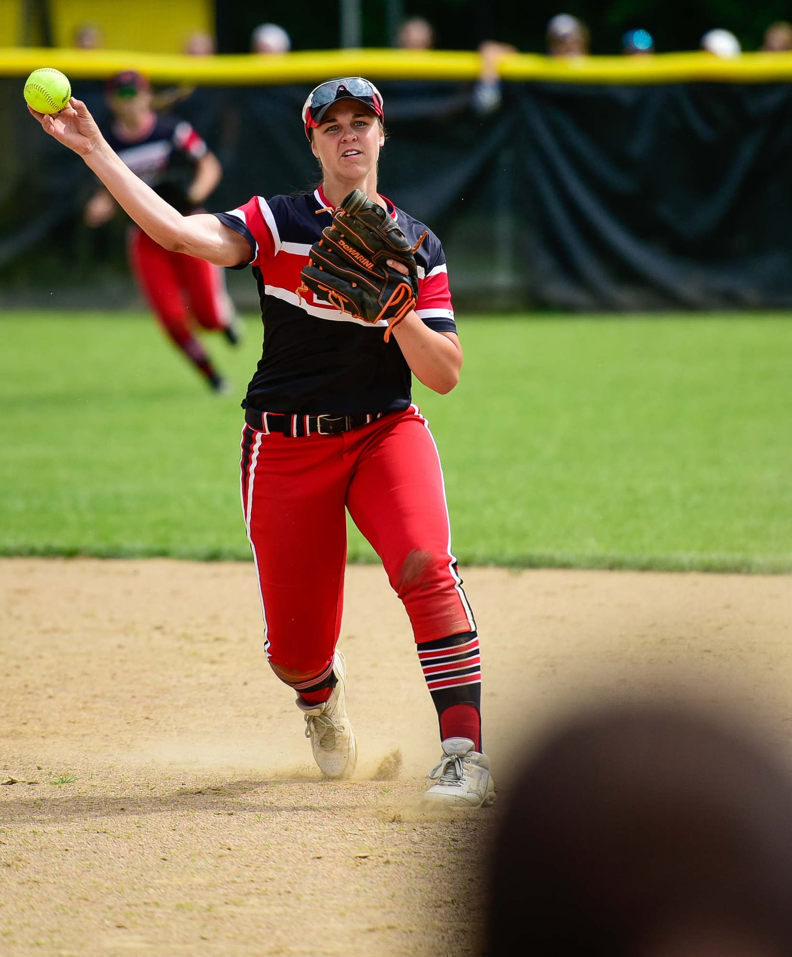 Lakota West shortstop Allie Cummins makes a throw to first base during Wednesday’s Division I regional semifinal against Lebanon at Centerville. NICK GRAHAM/STAFF