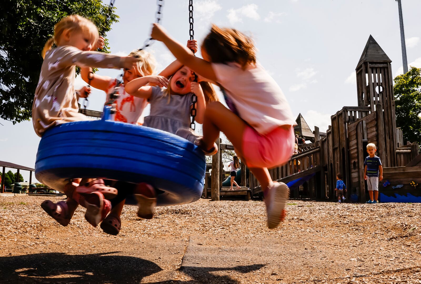 A group of kids play on the tire swing Wednesday, Aug. 21, 2024 on Van Gorden Road in Liberty Township. Howe has been coming to the playground for years and doesn't want to see it torn down. NICK GRAHAM/STAFF