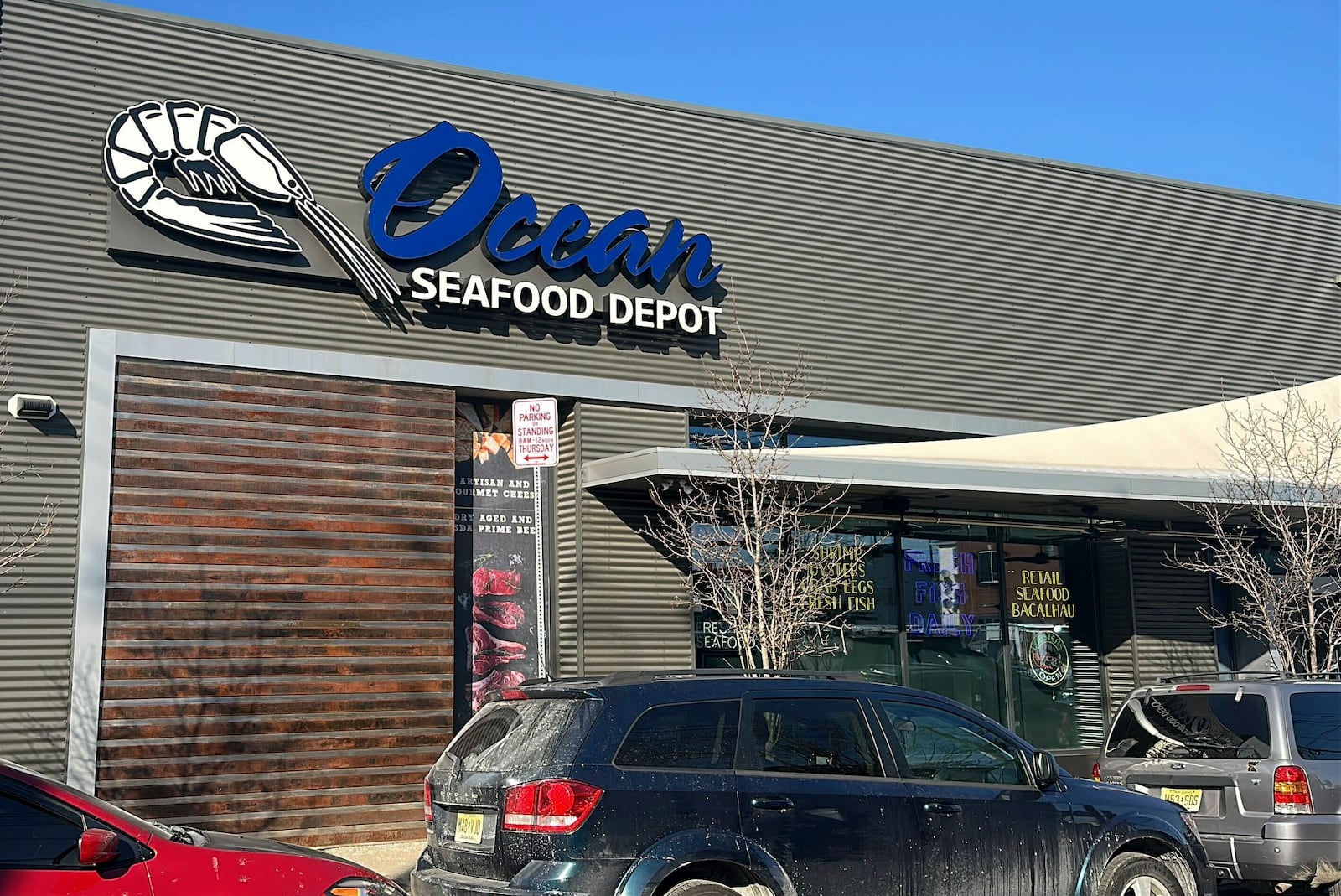 Cars sit parked outside an Ocean Seafood Depot store, Friday, Jan. 24, 2025, in Newark, N.J. . (AP Photo/Ted Shaffrey)