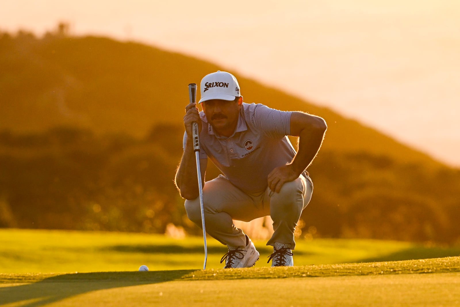 Keegan Bradley lines up a putt on the 15th hole of the South Course at Torrey Pines during the second round of the Farmers Insurance Open golf tournament Thursday, Jan. 23, 2025, in San Diego. (AP Photo/Denis Poroy)