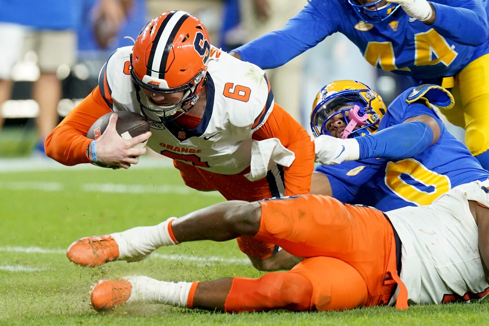 Pittsburgh linebacker Braylan Lovelace (0) sacks Syracuse quarterback Kyle McCord (6) during the first half of an NCAA college football game, Thursday, Oct. 24, 2024, in Pittsburgh. (AP Photo/Matt Freed)