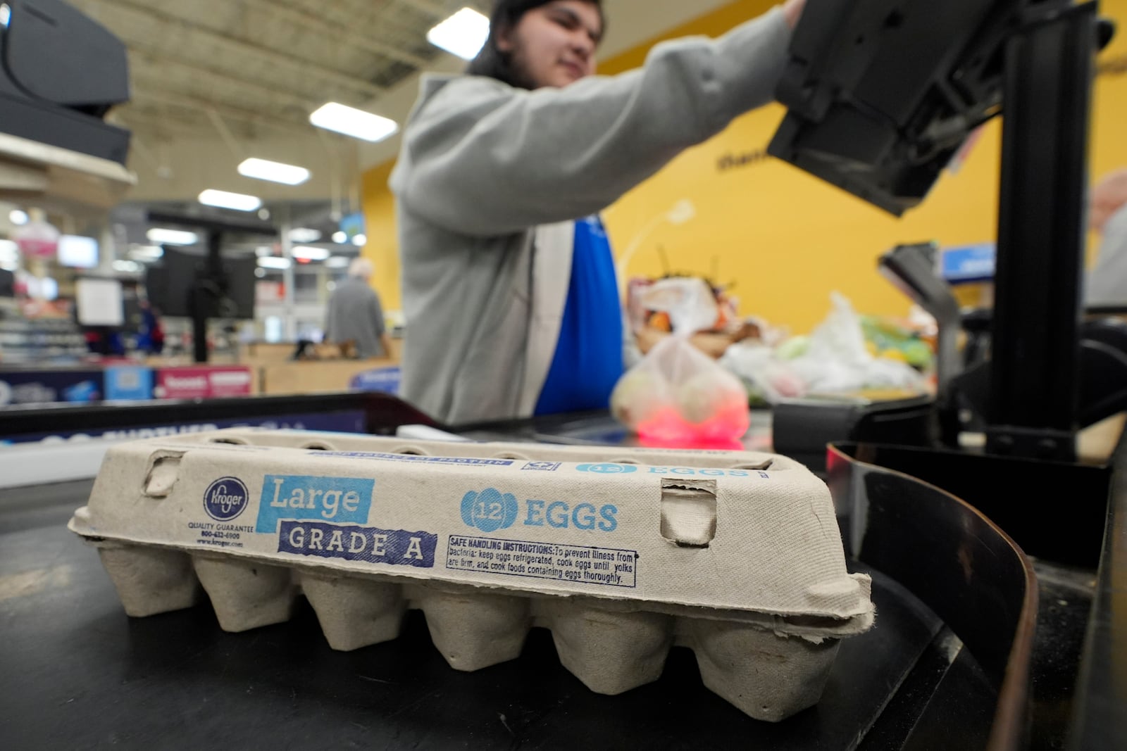 FILE - Cashier Josh Jimenez rings up egg for sale at a grocery store on Friday, Feb. 7, 2025, in Dallas. (AP Photo/LM Otero, File)