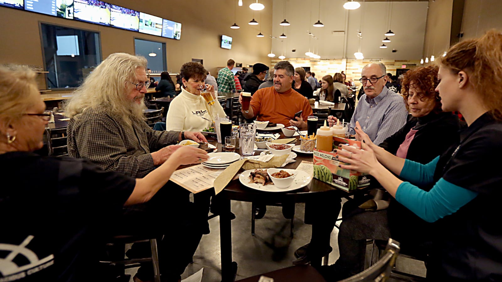 Guests eat and drink during a sneak preview event Jan. 18 for Rivertown Brewing Company in Monroe. The new brewery opens to the public Friday, Jan. 20. E.L. HUBBARD/CONTRIBUTED