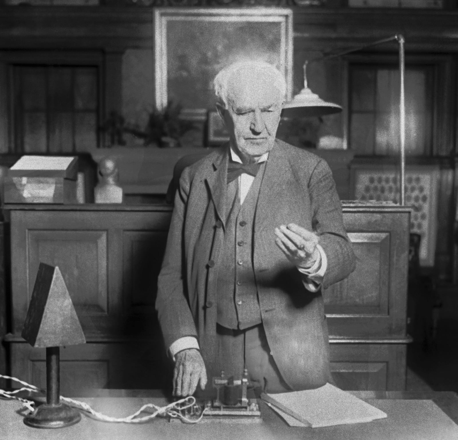 File - Thomas Edison presses a button in West Orange, N.J., in 1928 which turns on street lights in Seattle. New federal rules governing the energy efficiency of lighting systems went into full effect Tuesday, effectively ending the sale and manufacture of bulbs that trace their origin to an 1880 Thomas Edison patent. (AP Photo/File)