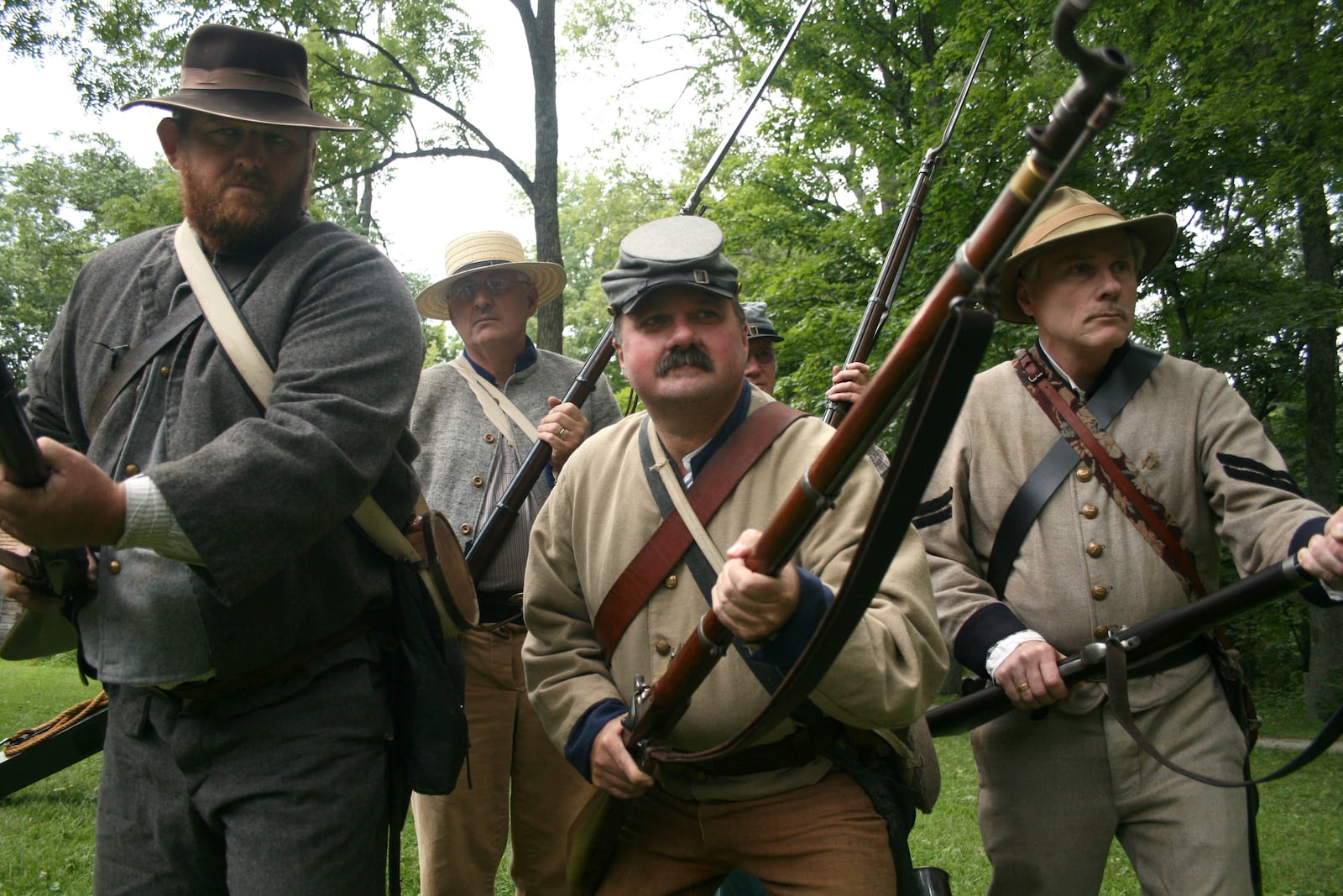 The Ninth Kentucky Civil War Group prepares to charge during a battle re-enactment Saturday, July 18, at Governor Bebb Preseve and Pioneer Village in Morgan Twp. Community members can tour the Pioneer Village cabins, see Civil War demonstrations and view exhibits again today, July 19, from noon to 5 p.m.