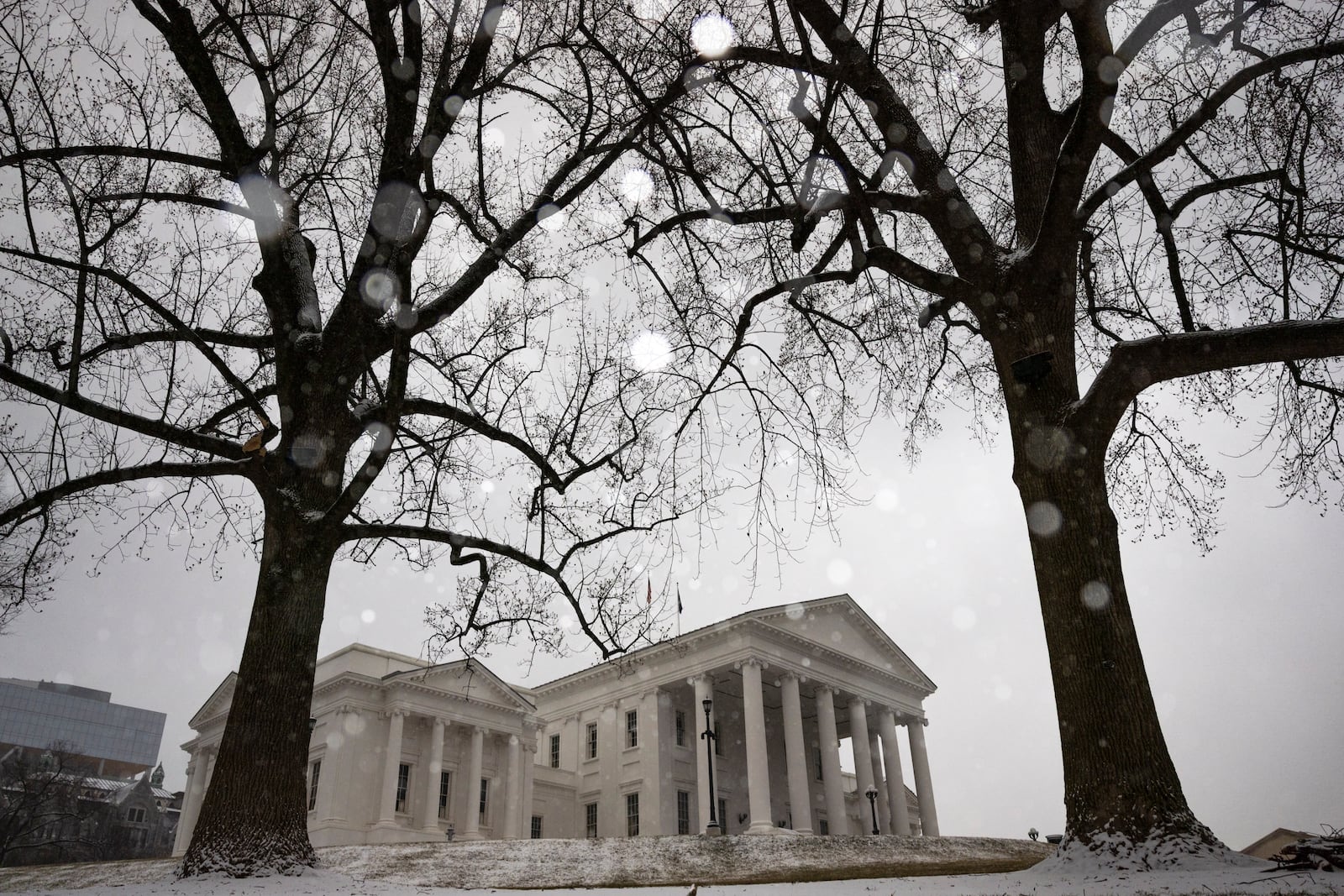 Snow falls on the Virginia State Capitol Building, in Richmond, Va., Wednesday, Feb. 19, 2025. (Mike Kropf/Richmond Times-Dispatch via AP)