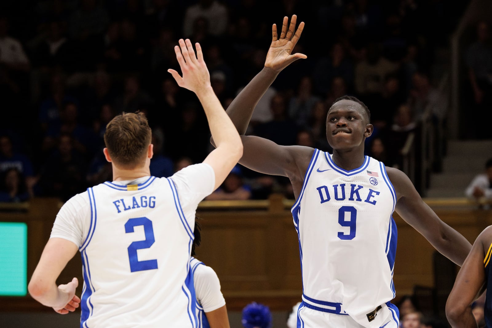 Duke's Khaman Maluach (9) and Cooper Flagg (2) high-five after a play during the second half of an NCAA college basketball game against California in Durham, N.C., Wednesday, Feb. 12, 2025. (AP Photo/Ben McKeown)