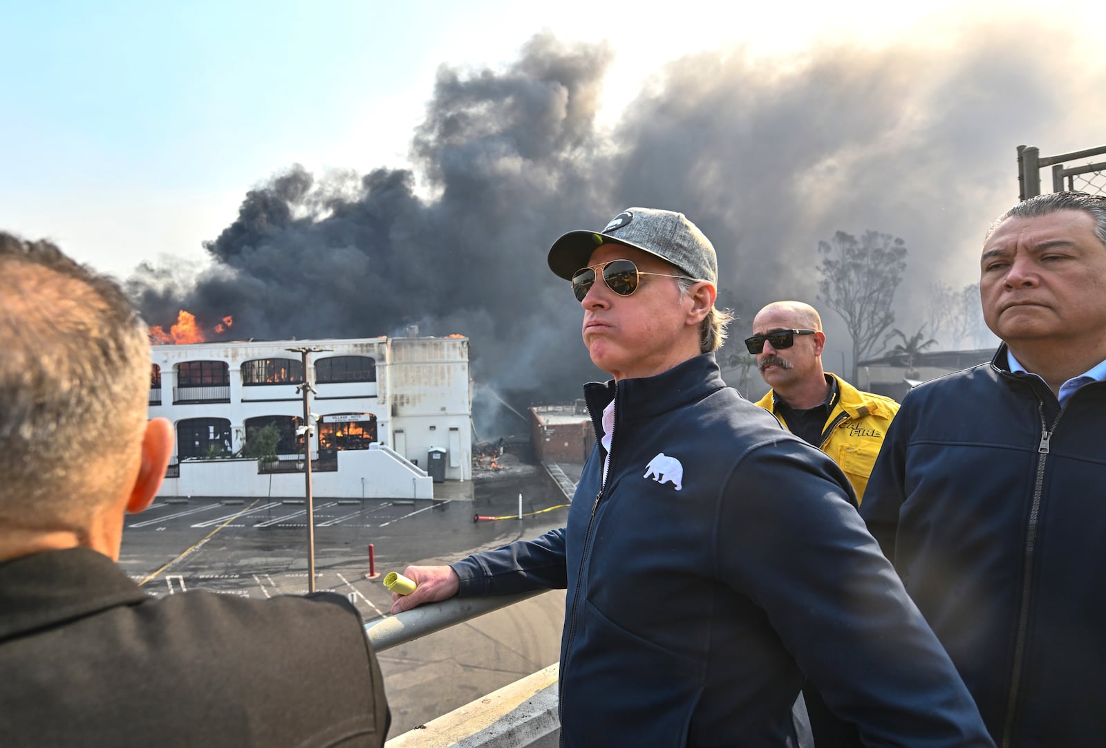 California Governor Gavin Newsom, left, surveys damage in Pacific Palisades with CalFire's Nick Schuler, center, and Senator Alex Padilla, D-Calif.) during the Palisades Fire Wednesday, Jan. 8, 2025, in Pacific Palisades, Calif. (Jeff Gritchen/The Orange County Register via AP)