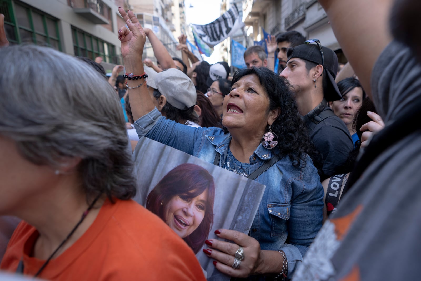 Supporters of former President Cristina Fernández rally outside her residence after a tribunal upheld a six-year sentence term and lifetime ban from holding public office sentence against Fernández, in Buenos Aires, Argentina, Wednesday, Nov. 13, 2024. (AP Photo/Victor R. Caivano)