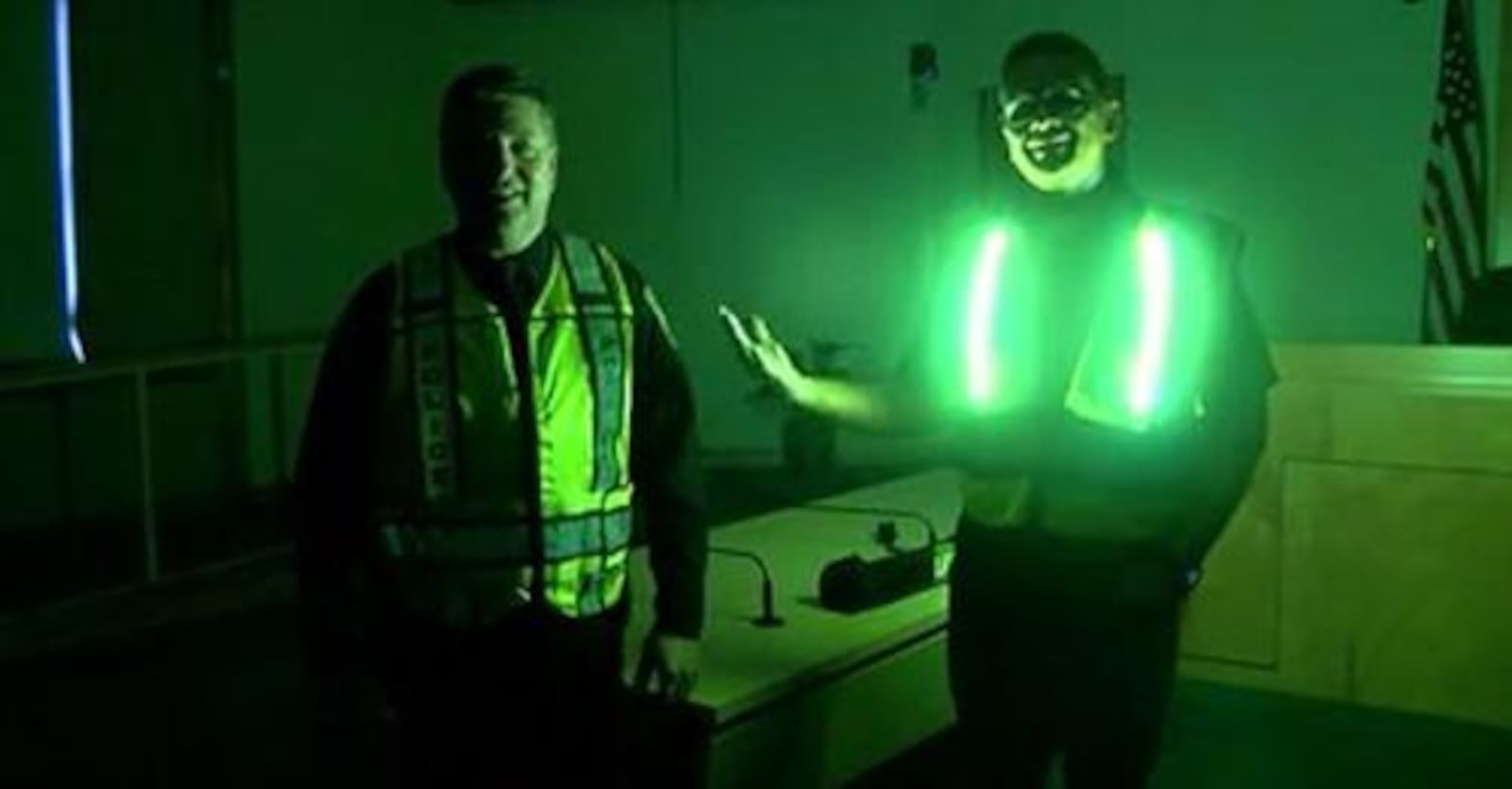 Officer Don Campbell demonstrates Lit LED Safety Vests verses standard reflective vest. SUBMITTED