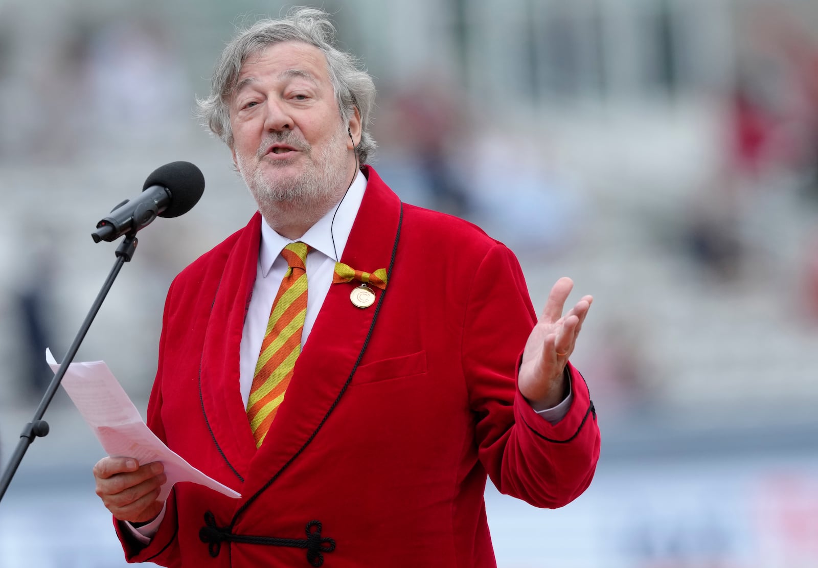 FILE - Stephen Fry, President of Marylebone Cricket Club, MCC, speaks on Red for Ruth Day, before the start of day two of the second Ashes Test cricket match at Lord's Cricket Ground, London, England, Thursday, June 29, 2023. (AP Photo/Kirsty Wigglesworth, File)