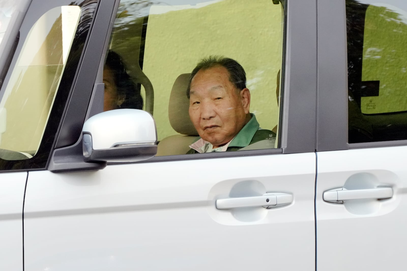 Iwao Hakamada, who was on death row for nearly a half-century and was acquitted last month by the Shizuoka District Court, rides a car in Hamamatsu, Shizuoka prefecture, central Japan, Thursday, Oct. 17, 2024. (AP Photo/Eugene Hoshiko)