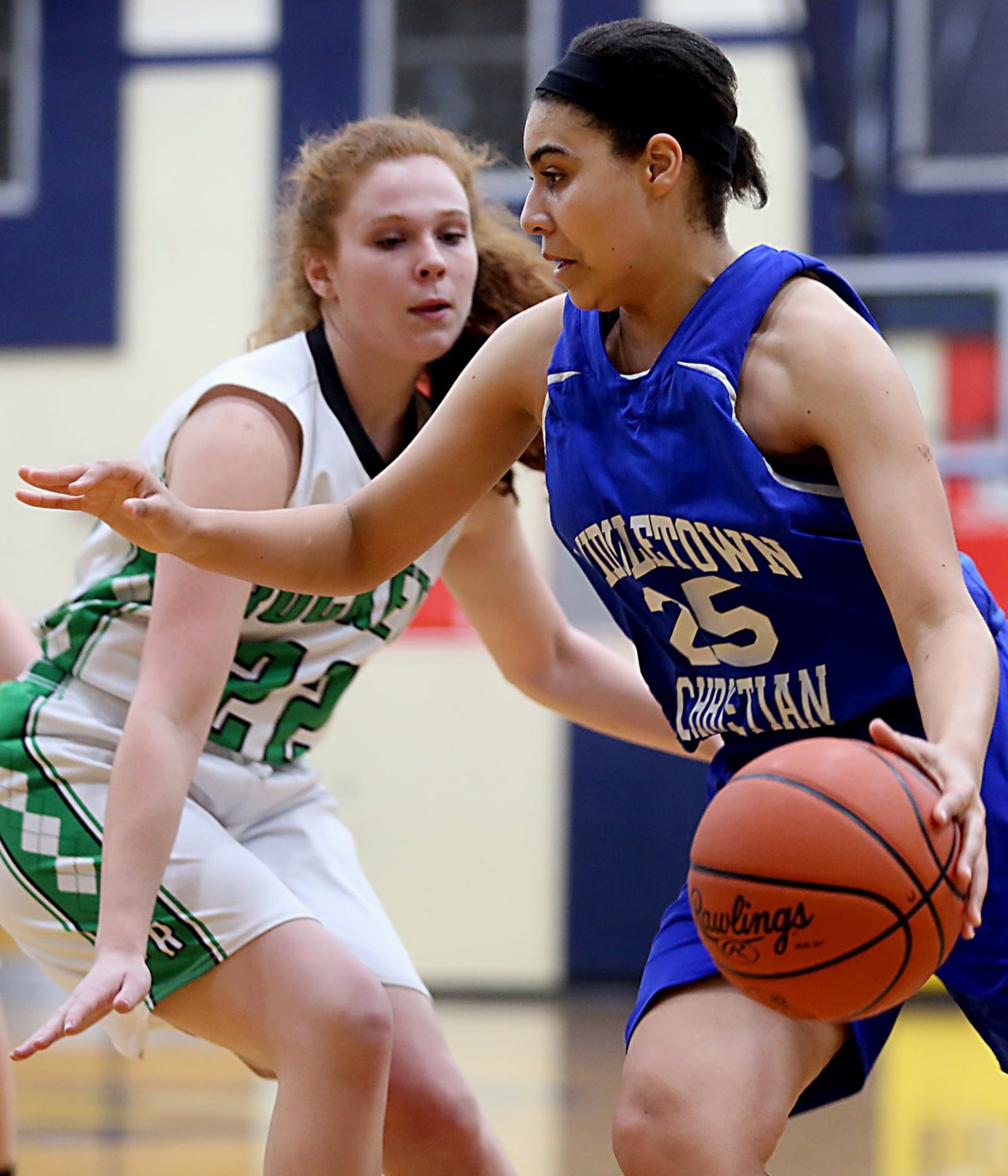 Middletown Christian’s Kayla Arington drives around Fayetteville’s Hannah Wiederhold on Tuesday night during their Division IV sectional game at Monroe. CONTRIBUTED PHOTO BY E.L. HUBBARD