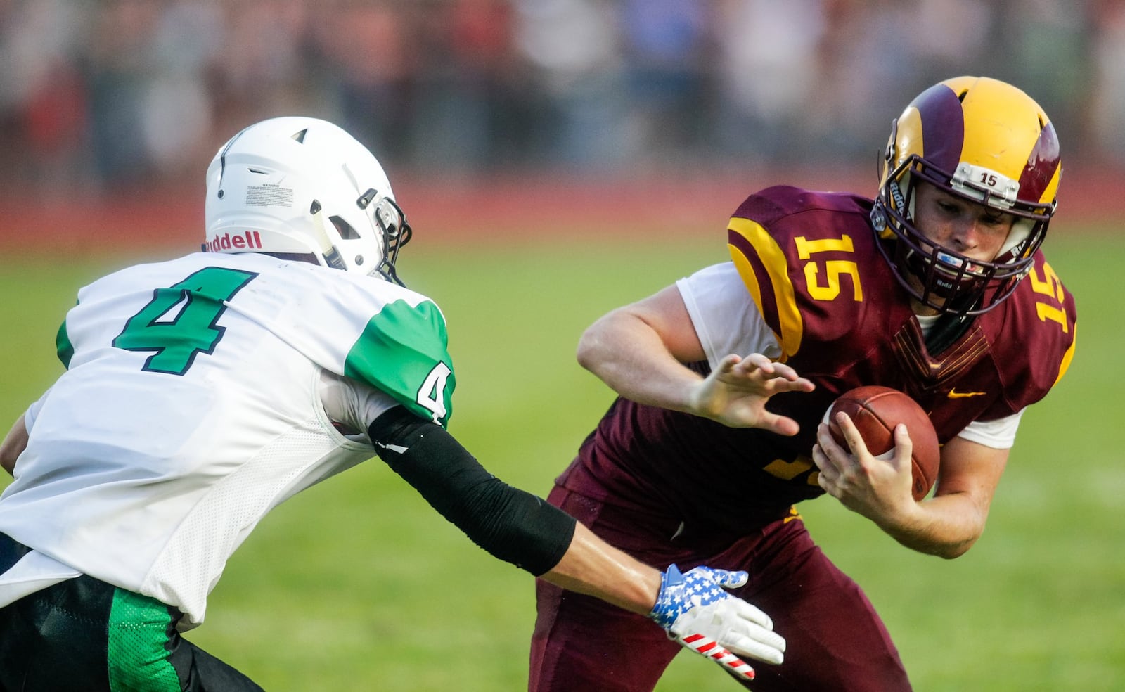 Ross running back Dylan Caldwell carries the ball while being defended by Badin’s Luke Tabler during their season opener Aug. 24 at Robinson Field in Ross Township. Badin won 41-20. NICK GRAHAM/STAFF