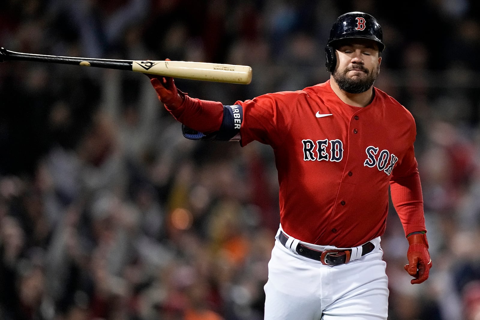 Boston Red Sox's Kyle Schwarber tosses his bat after a grand slam against the Houston Astros during Game 3 of baseball's American League Championship Series on Oct. 18. Schwarber is a free agent and unsure where he will play next season. (AP Photo/David J. Phillip)