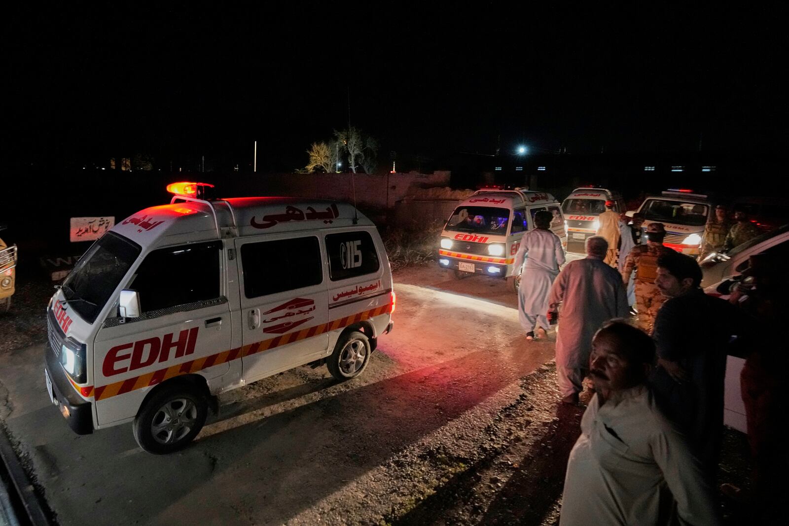 Ambulances carrying wounded survivors rescued by security forces from a passenger train attacked by insurgents leave a railway station in Much, Pakistan's southwestern Balochistan province, Wednesday, March 12, 2025. (AP Photo/Anjum Naveed)