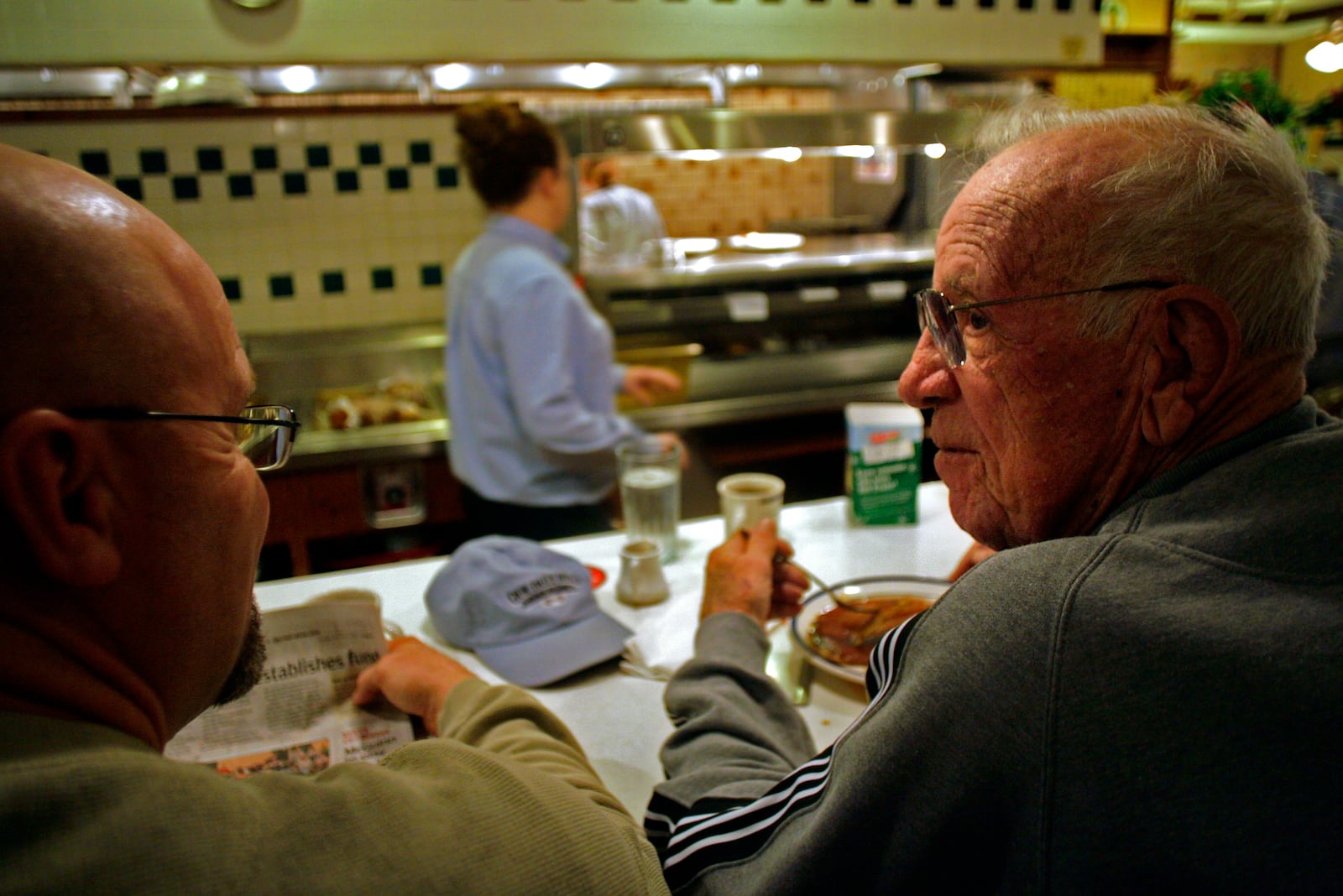 Joe Nuxhall, right, and Harry Brown sit in January 2007 at the counter of Bob Evans on Dixie Highway in Fairfield. 