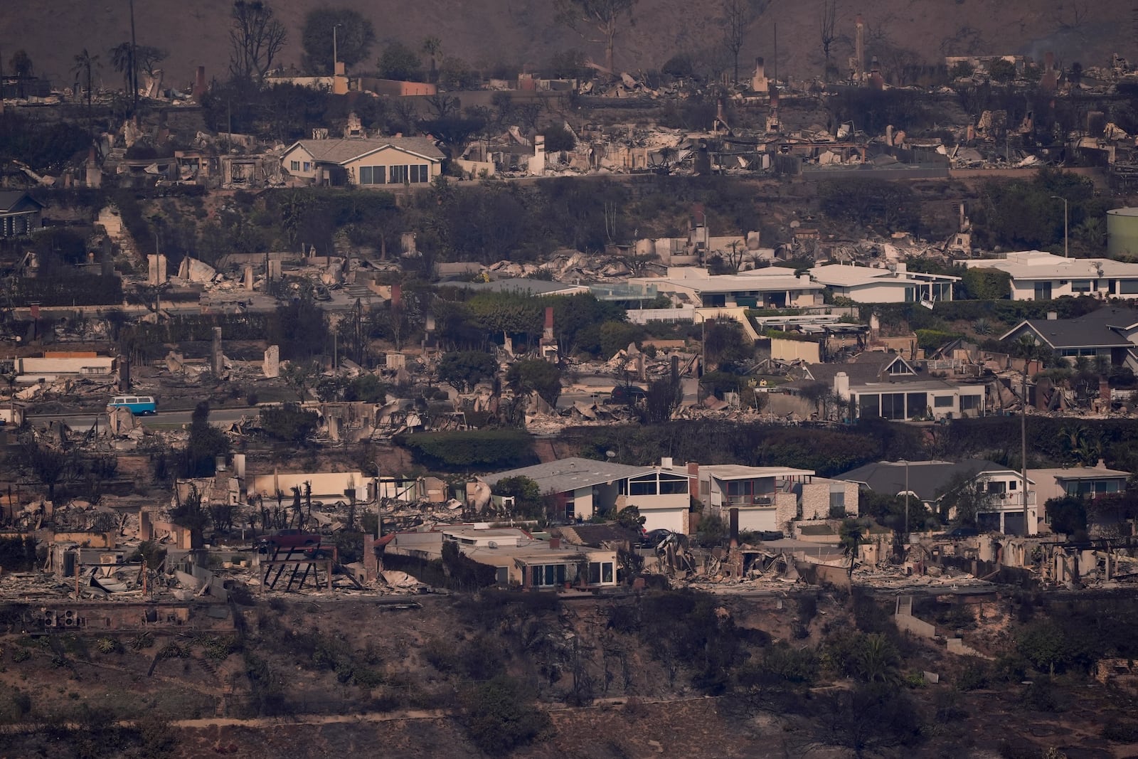 The devastation from the Palisades Fire is seen from the air in the Pacific Palisades neighborhood of Los Angeles, Thursday, Jan. 9, 2025. (AP Photo/Mark J. Terrill)