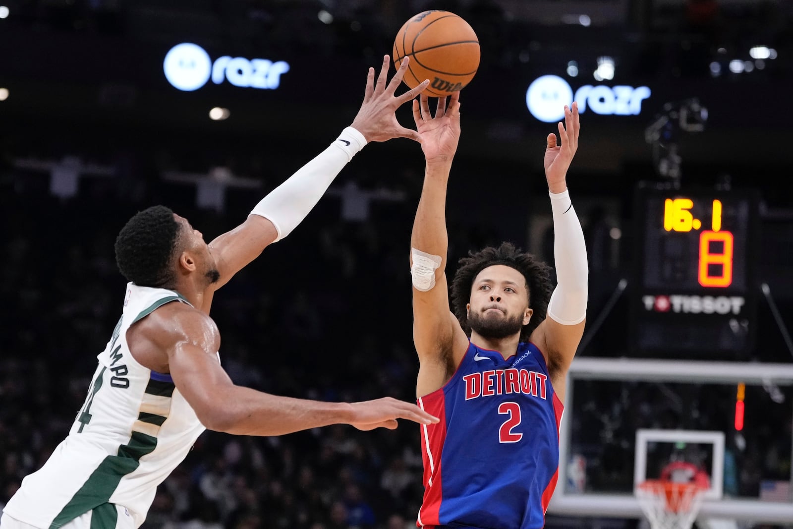 Detroit Pistons' Cade Cunningham shoots past Milwaukee Bucks' Giannis Antetokounmpo during the first half of an NBA basketball game Wednesday, Nov. 13, 2024, in Milwaukee. (AP Photo/Morry Gash)