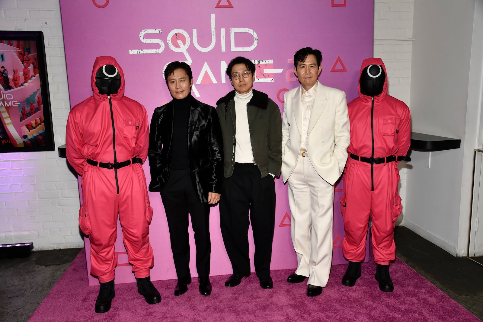 Lee Byung-hun, left, Hwang Dong-kyuk and Lee Jung-jae pose together during a photo call for Netflix's "Squid Game" season two at Metrograph on Monday, Dec. 16, 2024, in New York. (Photo by Evan Agostini/Invision/AP)