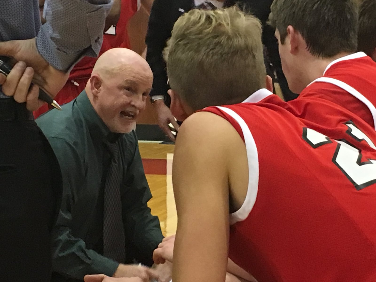 Madison coach Jeff Smith talks to his team in a timeout Dec. 28, 2017, during the Brian Cook Classic in Madison Township. The host Mohawks advanced with a 60-56 win over Cincinnati Christian. RICK CASSANO/STAFF