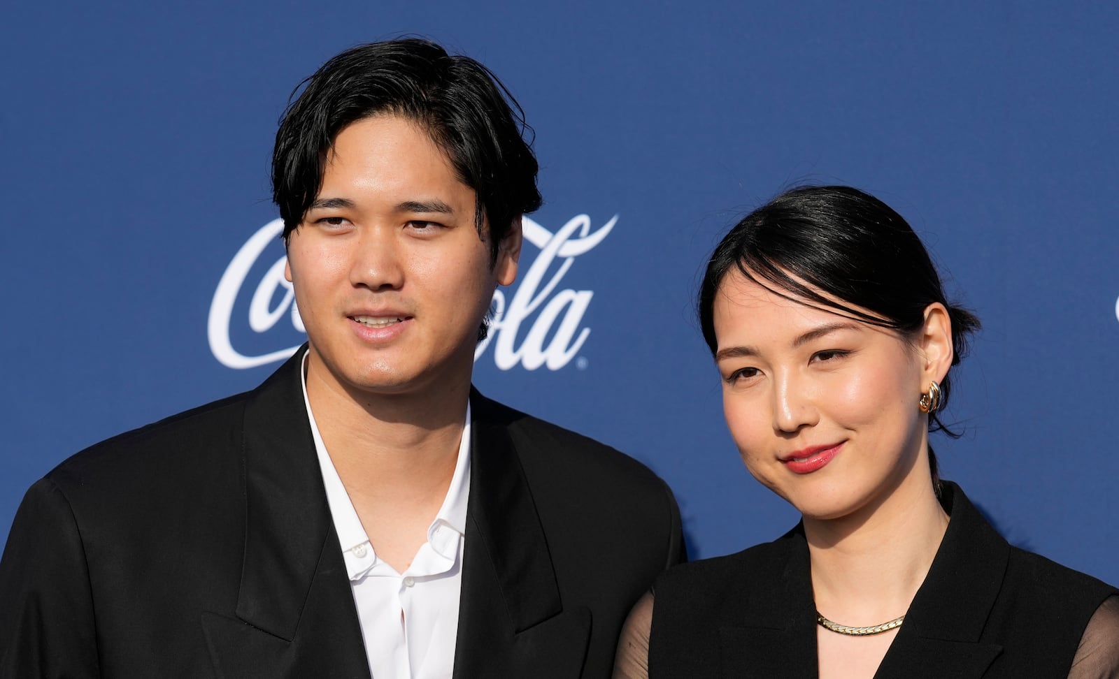 FILE - Los Angeles Dodgers' Shohei Ohtani and his wife Mamiko Tanaka pose together at the Los Angeles Dodgers Foundation's 2024 Blue Diamond Gala, on May 2, 2024, at Dodger Stadium in Los Angeles. (AP Photo/Chris Pizzello, File)