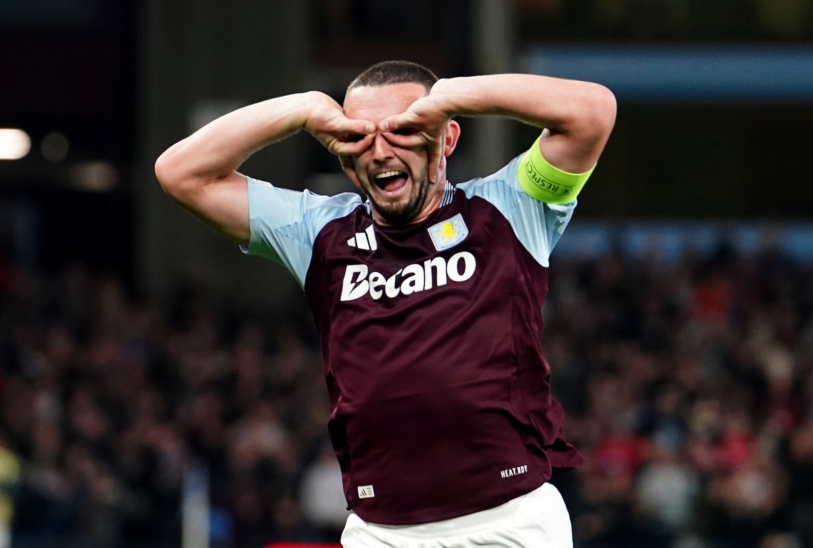 Aston Villa's John McGinn celebrates scoring their side's first goal of the game during the Champions League opening phase soccer match between Aston Villa and Bologna at the Villa Park in Birmingham, England, Tuesday, Oct. 22, 2024. (David Davies/PA via AP)