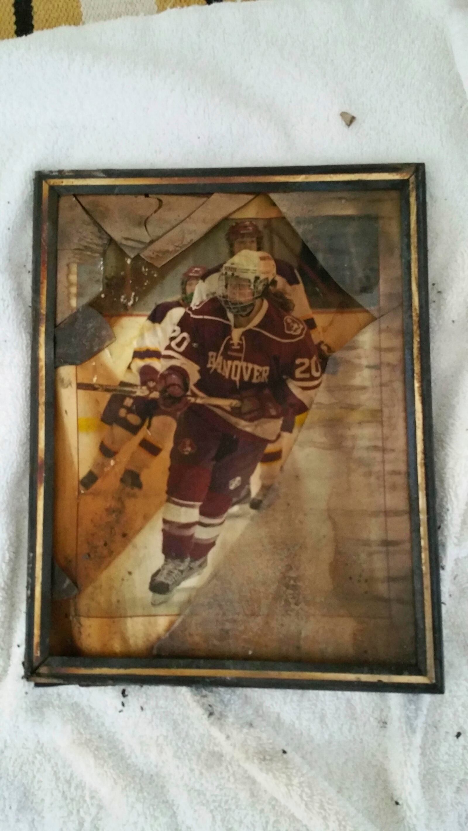 A photo recovered from the ashes of the Tecca family’s home shows their youngest child, Grace, as a high school hockey player in 2014. (Tecca family via AP)